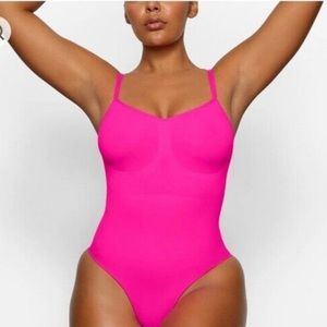 Skins bodysuit in sold out color “flamingo”